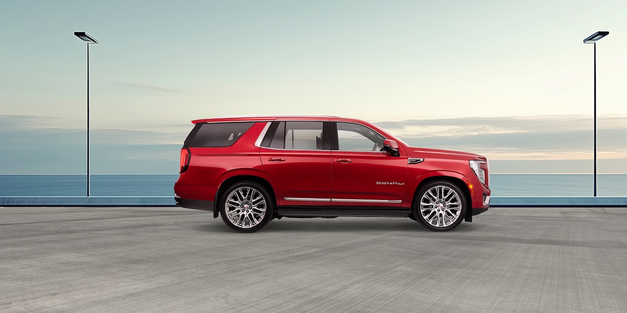 Red GMC Yukon Denali side profile